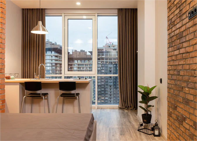 velvet-curtains-hanging-in-the-floor-to-ceiling-windows-of-an-apartment