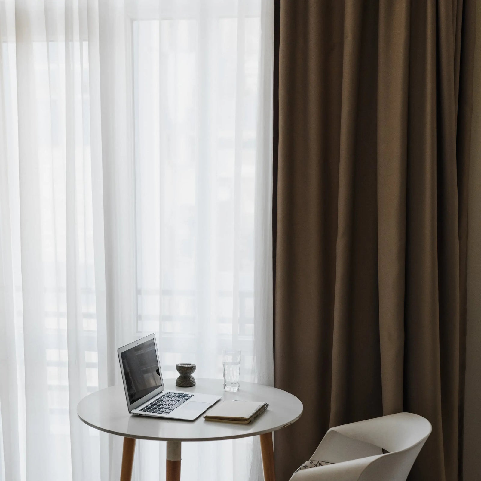 velvet-curtains-hanging-in-a-relaxed-workspace