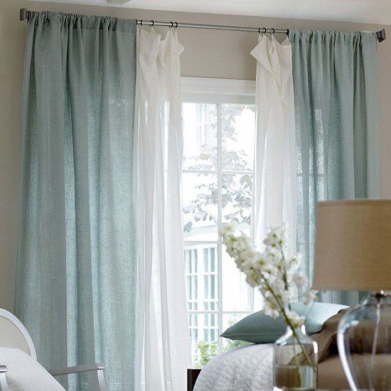 gray-curtains-and-white-sheers-hanging-in-the-living-room-view